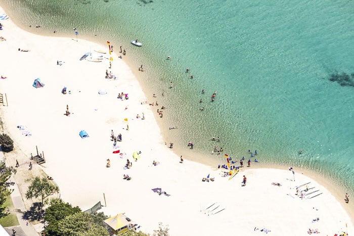 aerial shot of people at Tallebudgera Creek on clear sunny day 