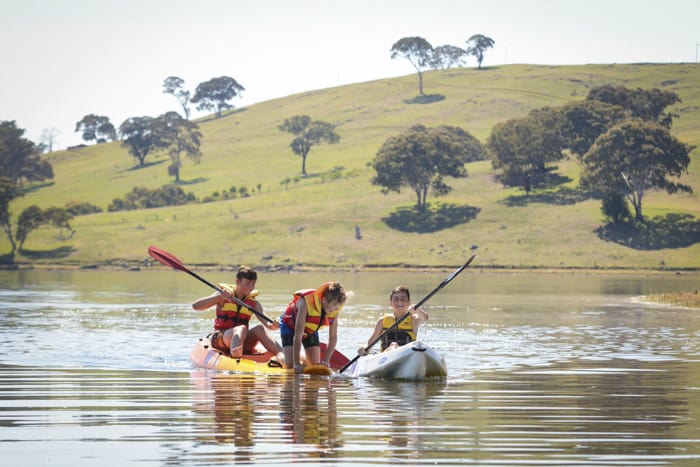 kids in kayaks on Carcoar Dam in the NSW Central West 