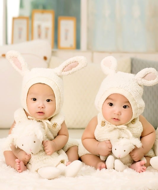 twins babies on a fluffy rug